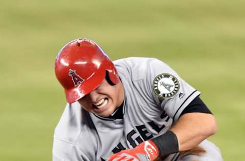 Los Angeles Angels center fielder Mike Trout (27) injures his hand after sliding into second base. Mandatory Credit: Steve Mitchell-USA TODAY Sports