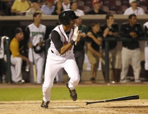 Jun 18, 2013; Dayton, OH, USA; East center fielder Dalton Pompey watches his game winning RBI single in the ninth inning during the Midwest League-All Star Game at Fifth Third Field. East beat West 6-5. Mandatory Credit: David Kohl-USA TODAY Sports