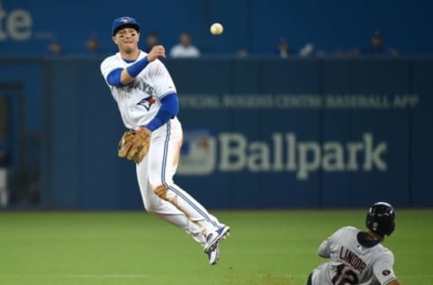 Sep 2, 2015; Toronto, Ontario, CAN; Toronto Blue Jays shortstop Troy Tulowitzki (2) throws to first base to complete a double play after forcing out Cleveland Indians shortstop 