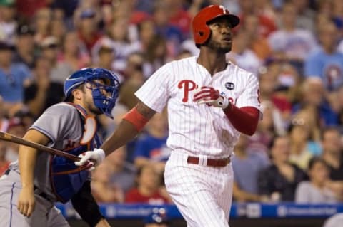 Aug 24, 2015; Philadelphia, PA, USA; Philadelphia Phillies right fielder Domonic Brown (9) watches with New York Mets catcher Travis