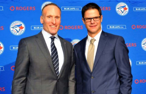 Dec 4, 2015; Toronto, Ontario, Canada; Toronto Blue Jays president Mark Shapiro (left) welcomes new club general manager Ross Atkins during a media conference at Rogers Centre. Mandatory Credit: Dan Hamilton-USA TODAY Sports