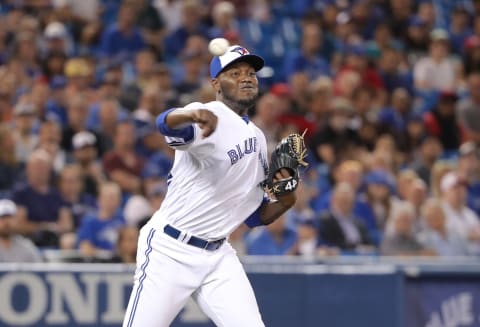 TORONTO, ON – SEPTEMBER 6: David Paulino #22 of the Toronto Blue Jays makes a throwing error to first base as he fields a soft grounder in the eighth inning during MLB game action against the Cleveland Indians at Rogers Centre on September 6, 2018 in Toronto, Canada. (Photo by Tom Szczerbowski/Getty Images)