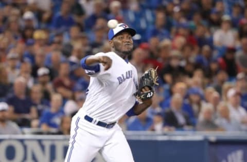 TORONTO, ON – SEPTEMBER 6: David Paulino #22 of the Toronto Blue Jays makes a throwing error to first base as he fields a soft grounder in the eighth inning during MLB game action against the Cleveland Indians at Rogers Centre on September 6, 2018 in Toronto, Canada. (Photo by Tom Szczerbowski/Getty Images)