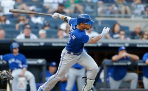 NEW YORK, NY – SEPTEMBER 15: Lourdes Gurriel Jr. #13 of the Toronto Blue Jays follows through on a second inning RBI single against the New York Yankees at Yankee Stadium on September 15, 2018 in the Bronx borough of New York City. (Photo by Jim McIsaac/Getty Images)