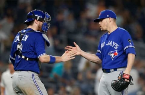 NEW YORK, NY – SEPTEMBER 15: Ken Giles #51 and Danny Jansen #9 of the Toronto Blue Jays celebrate after defeating the New York Yankees at Yankee Stadium on September 15, 2018 in the Bronx borough of New York City. (Photo by Jim McIsaac/Getty Images)