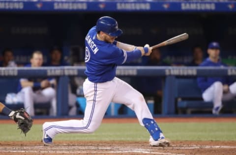 TORONTO, ON – MARCH 30: Danny Jansen #9 of the Toronto Blue Jays hits a single in the eighth inning during MLB game action against the Detroit Tigers at Rogers Centre on March 30, 2019 in Toronto, Canada. (Photo by Tom Szczerbowski/Getty Images)