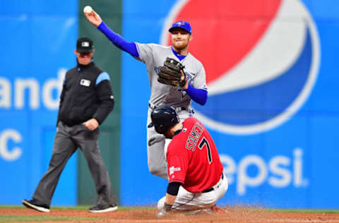 CLEVELAND, OHIO – APRIL 05: Third baseman Brandon Drury #3 of the Toronto Blue Jays throws out Leonys Martin #2 at first as Eric Stamets #7 of the Cleveland Indians is out at second for a double play to end the third inning at Progressive Field on April 05, 2019 in Cleveland, Ohio. (Photo by Jason Miller/Getty Images)