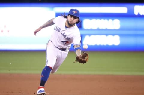 TORONTO, ON – MAY 07: Freddy Galvis #16 of the Toronto Blue Jays flips the ball with his glove to get the baserunner at first base in the second inning during MLB game action against the Minnesota Twins at Rogers Centre on May 7, 2019 in Toronto, Canada. (Photo by Tom Szczerbowski/Getty Images)