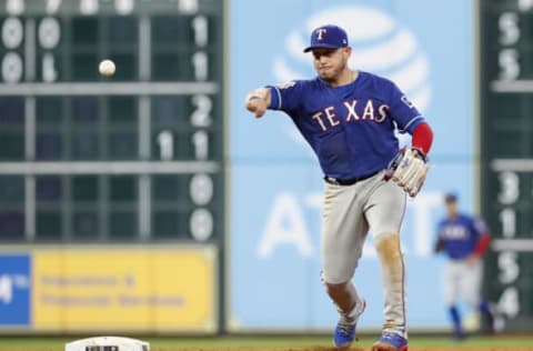 HOUSTON, TX – MAY 10: Asdrubal Cabrera #14 of the Texas Rangers throws to first for a double play in the eighth inning against the Houston Astros at Minute Maid Park on May 10, 2019 in Houston, Texas. (Photo by Tim Warner/Getty Images)