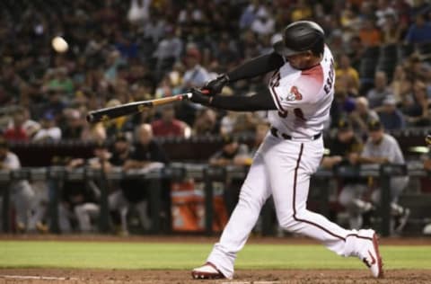 PHOENIX, ARIZONA – MAY 13: Eduardo Escobar #5 of the Arizona Diamondbacks hits a solo home run in the fourth inning of the MLB game against the Pittsburgh Pirates at Chase Field on May 13, 2019 in Phoenix, Arizona. (Photo by Jennifer Stewart/Getty Images)