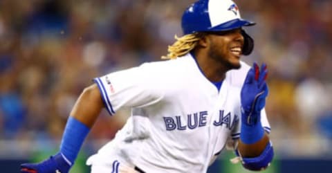 TORONTO, ON – JULY 22: Vladimir Guerrero Jr. #27 of the Toronto Blue Jays runs and is called out at second base in the second inning during a MLB game against the Cleveland Indians at Rogers Centre on July 22, 2019 in Toronto, Canada. (Photo by Vaughn Ridley/Getty Images)