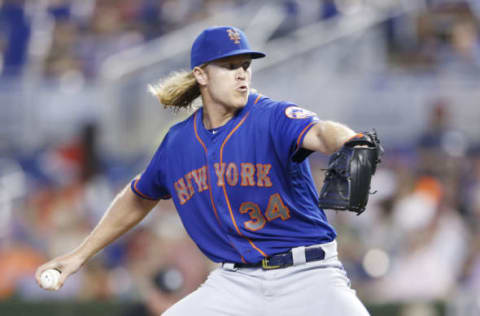 MIAMI, FLORIDA – JULY 13: Noah Syndergaard #34 of the New York Mets delivers a pitch in the first inning against the Miami Marlins at Marlins Park on July 13, 2019 in Miami, Florida. (Photo by Michael Reaves/Getty Images)