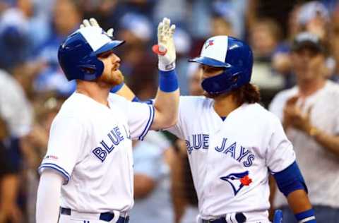 TORONTO, ON – AUGUST 16: Derek Fisher #20 of the Toronto Blue Jays celebrates a 2 run home run with Bo Bichette #11 in the second inning during a MLB game against the Seattle Mariners at Rogers Centre on August 16, 2019 in Toronto, Canada. (Photo by Vaughn Ridley/Getty Images)