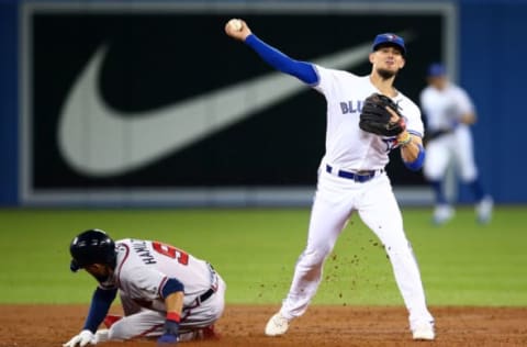 TORONTO, ON – AUGUST 27: Billy Hamilton #9 of the Atlanta Braves is out at second as Cavan Biggio #8 of the Toronto Blue Jays throws to first base in the third inning during an MLB game at Rogers Centre on August 27, 2019 in Toronto, Canada. (Photo by Vaughn Ridley/Getty Images)