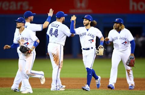 TORONTO, ON – AUGUST 27: (L-R) Cavan Biggio #8, Justin Smoak #14, Rowdy Tellez #44, Bo Bichette #11 and Vladimir Guerrero Jr. #27 of the Toronto Blue Jays celebrate the win at the end of the ninth inning during a MLB game against the Atlanta Braves at Rogers Centre on August 27, 2019 in Toronto, Canada. (Photo by Vaughn Ridley/Getty Images)