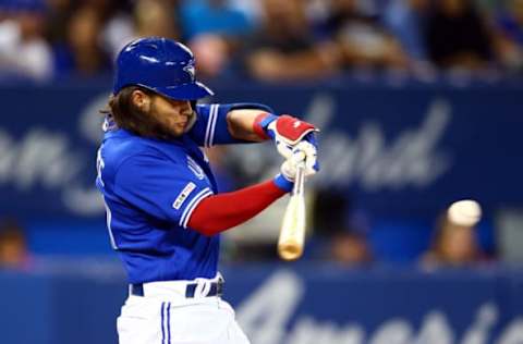 TORONTO, ON – AUGUST 30: Bo Bichette #11 of the Toronto Blue Jays doubles in the fourth inning during a MLB game against the Houston Astros at Rogers Centre on August 30, 2019 in Toronto, Canada. (Photo by Vaughn Ridley/Getty Images)