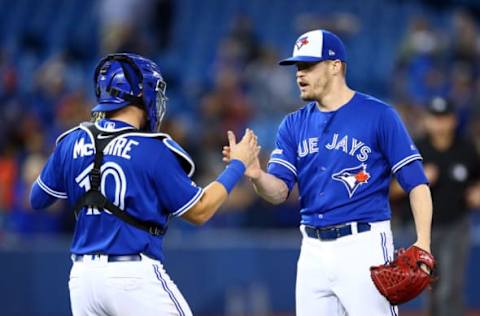 TORONTO, ON – SEPTEMBER 15: Ken Giles #51 of the Toronto Blue Jays shakes hands with Reese McGuire #10 after striking out Aaron Judge #99 of the New York Yankees for the final out of a MLB game at Rogers Centre on September 15, 2019 in Toronto, Canada. (Photo by Vaughn Ridley/Getty Images)