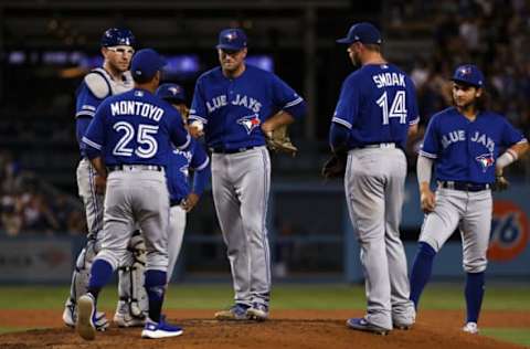 LOS ANGELES, CALIFORNIA – AUGUST 20: Relief pitcher Justin Shafer #50 of the Toronto Blue Jays hands the ball to manager manager Charlie Montoyo #25 before leaving the game in the sixth inning of the MLB game at Dodger Stadium on August 20, 2019 in Los Angeles, California. (Photo by Victor Decolongon/Getty Images)