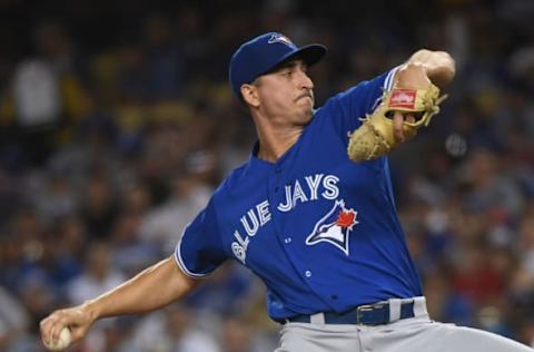 LOS ANGELES, CALIFORNIA – AUGUST 22: Jacob Waguespack #62 of the Toronto Blue Jays pitches during the second inning against the Los Angeles Dodgers at Dodger Stadium on August 22, 2019 in Los Angeles, California. (Photo by Harry How/Getty Images)