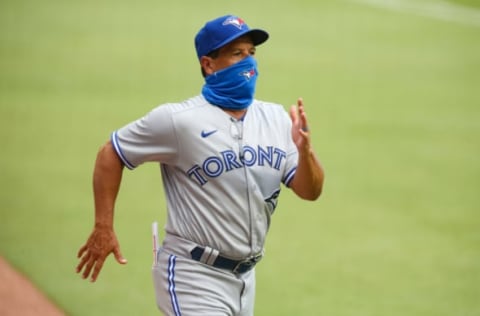 ATLANTA, GA – AUGUST 5: Manager Charlie Montoyo #25 heads to home plate prior to a game against the Atlanta Braves at Truist Park on August 5, 2020 in Atlanta, Georgia. (Photo by Carmen Mandato/Getty Images)