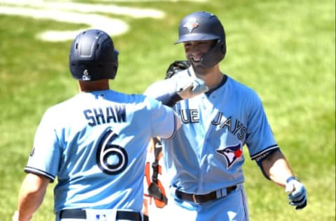 BALTIMORE, MD – AUGUST 19: Randal Grichuk #15 of the Toronto Blue Jays celebrates a two run home with Travis Shaw #6 in the sixth inning during a baseball game against the Baltimore Orioles at Oriole Park at Camden Yards on August 19, 2020 in Baltimore, Maryland. (Photo by Mitchell Layton/Getty Images)