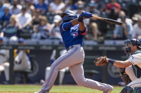 SEATTLE, WA – AUGUST 15: Teoscar Hernandez #37 of the Toronto Blue Jays hits a solo home run off of starting pitcher Logan Gilbert #36 of the Seattle Mariners during the second inning of a game at T-Mobile Park on August 15, 2021 in Seattle, Washington. (Photo by Stephen Brashear/Getty Images)