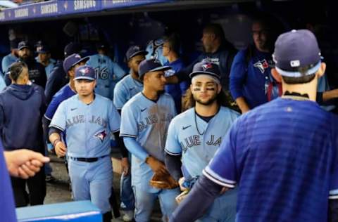 TORONTO, ONTARIO – OCTOBER 3: Bo Bichette #11 of the Toronto Blue Jays and teammates leave the field after defeating the Baltimore Orioles in their MLB game at the Rogers Centre on October 3, 2021 in Toronto, Ontario, Canada. (Photo by Mark Blinch/Getty Images)