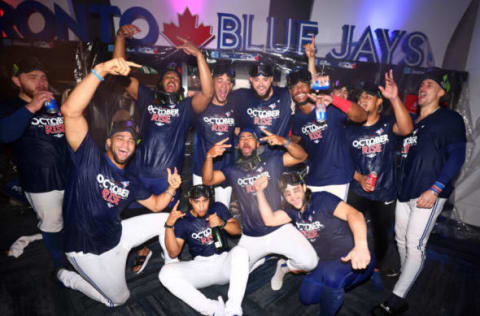 TORONTO, ON – SEPTEMBER 30: The Toronto Blue Jays celebrate clinching a playoff spot after the win against the Boston Red Sox at Rogers Centre on September 30, 2022 in Toronto, Ontario, Canada. (Photo by Vaughn Ridley/Getty Images)