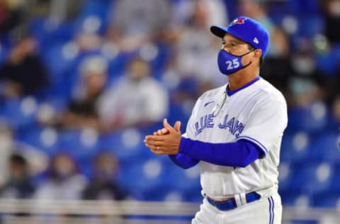 DUNEDIN, FLORIDA – APRIL 12: Manager Charlie Montoyo #25 of the Toronto Blue Jays walks out to the mound to relieve Rafael Dolis during the seventh inning against the New York Yankees at TD Ballpark on April 12, 2021 in Dunedin, Florida. (Photo by Julio Aguilar/Getty Images)