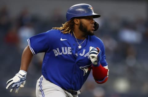 NEW YORK, NY – MAY 25: Vladimir Guerrero Jr. #27 of the Toronto Blue Jays hits a 2-run home run against the New York Yankees during the third inning at Yankee Stadium on May 25, 2021 in the Bronx borough of New York City. (Photo by Adam Hunger/Getty Images)