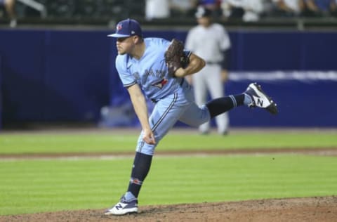 BUFFALO, NEW YORK – JUNE 17: Jeremy Beasley #59 of the Toronto Blue Jays throws a pitch during the ninth inning against the New York Yankees at Sahlen Field on June 17, 2021 in Buffalo, New York. (Photo by Joshua Bessex/Getty Images)