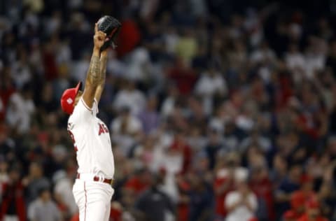 ANAHEIM, CALIFORNIA – AUGUST 30: Raisel Iglesias #32 of the Los Angeles Angels reacts to defeating the New York Yankees 8-7 in a game at Angel Stadium of Anaheim on August 30, 2021 in Anaheim, California. (Photo by Sean M. Haffey/Getty Images)