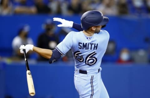 TORONTO, ON – SEPTEMBER 03: Kevin Smith #66 of the Toronto Blue Jays bats during a MLB game against the Oakland Athletics at Rogers Centre on September 3, 2021 in Toronto, Ontario, Canada. (Photo by Vaughn Ridley/Getty Images)