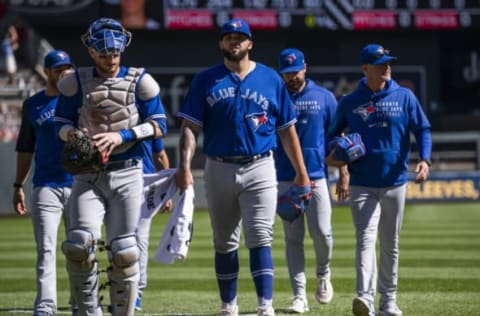 MINNEAPOLIS, MN – SEPTEMBER 26: Starting pitcher Alek Manoah #6 of the Toronto Blue Jays and catcher Danny Jansen #9 head to the dugout before the game against the Minnesota Twins at Target Field on September 26, 2021 in Minneapolis, Minnesota. (Photo by Stephen Maturen/Getty Images)