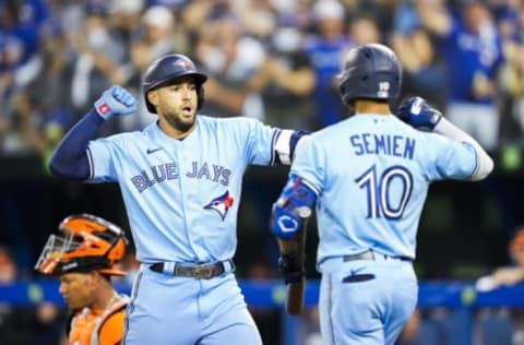 TORONTO, ONTARIO – OCTOBER 3: George Springer #4 of the Toronto Blue Jays celebrates a home run with Marcus Semien #10 against the Baltimore Orioles in the first inning during their MLB game at the Rogers Centre on October 3, 2021 in Toronto, Ontario, Canada. (Photo by Mark Blinch/Getty Images)