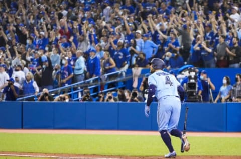 TORONTO, ONTARIO – OCTOBER 3: George Springer #4 of the Toronto Blue Jays hits a grand slam home run against the Baltimore Orioles in the third inning during their MLB game at the Rogers Centre on October 3, 2021 in Toronto, Ontario, Canada. (Photo by Mark Blinch/Getty Images)