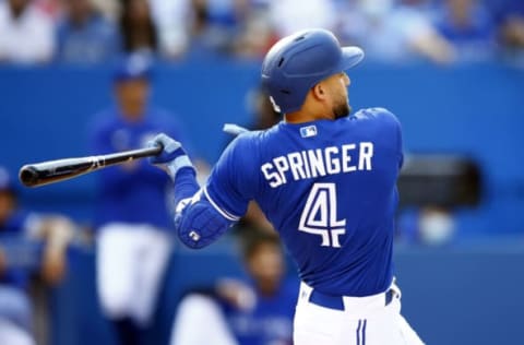 TORONTO, ON – OCTOBER 02: George Springer #4 of the Toronto Blue Jays hits a home run during a MLB game against the Baltimore Orioles at Rogers Centre on October 2, 2021 in Toronto, Ontario, Canada. (Photo by Vaughn Ridley/Getty Images)