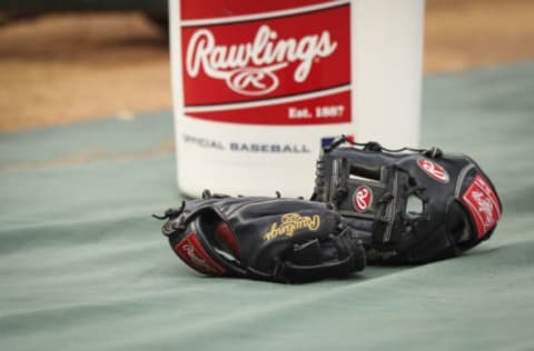 ANAHEIM, CALIFORNIA – MAY 27: Rawlings gloves are seen on the field during batting practice ahead of the game between the Los Angeles Angels and the Toronto Blue Jays at Angel Stadium of Anaheim on May 27, 2022 in Anaheim, California. (Photo by Meg Oliphant/Getty Images)