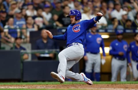 MILWAUKEE, WISCONSIN – JULY 05: Ian Happ #8 of the Chicago Cubs slides safely into home plate in the sixth inning against the Milwaukee Brewers at American Family Field on July 05, 2022 in Milwaukee, Wisconsin. (Photo by John Fisher/Getty Images)