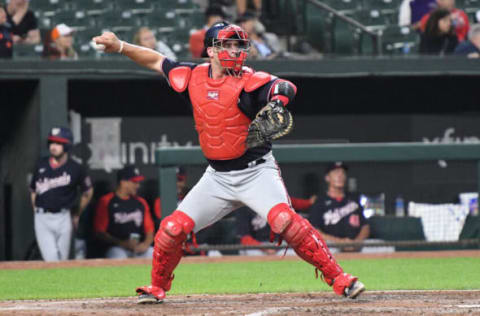 BALTIMORE, MD – JUNE 22: Riley Adams #15 of the Washington Nationals throws to second base during a baseball game against the Baltimore Orioles at Oriole Park at Camden Yards on June 22, 2022 in Baltimore, Maryland. (Photo by Mitchell Layton/Getty Images)