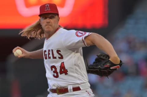 ANAHEIM, CA – JULY 12: Noah Syndergaard #34 of the Los Angeles Angels pitches in the game during the game against the Houston Astros at Angel Stadium of Anaheim on July 12, 2022 in Anaheim, California. (Photo by Jayne Kamin-Oncea/Getty Images)