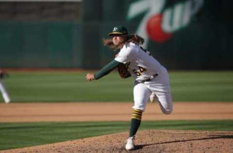 OAKLAND, CA – AUGUST 6: Kirby Snead #54 of the Oakland Athletics pitches during the game against the San Francisco Giants at RingCentral Coliseum on August 6, 2022 in Oakland, California. The Giants defeated the Athletics 7-3. (Photo by Michael Zagaris/Oakland Athletics/Getty Images)