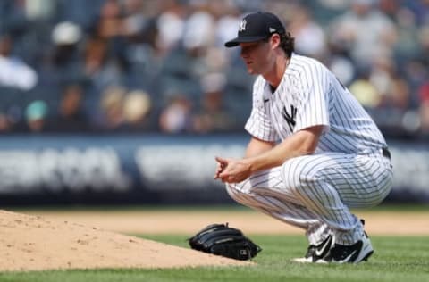 NEW YORK, NEW YORK – AUGUST 20: Gerrit Cole #45 of the New York Yankees reacts while pitching during the fifth inning against the Toronto Blue Jays at Yankee Stadium on August 20, 2022 in the Bronx borough of New York City. (Photo by Sarah Stier/Getty Images)