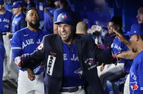 TORONTO, ON – SEPTEMBER 27: George Springer #4 of the Toronto Blue Jays celebrates his home run with the blue jacket against the New York Yankees in the first inning during their MLB game at the Rogers Centre on September 27, 2022 in Toronto, Ontario, Canada. (Photo by Mark Blinch/Getty Images)