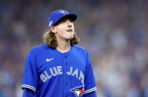 TORONTO, ONTARIO – OCTOBER 08: Kevin Gausman #34 of the Toronto Blue Jays walks back to the dugout after being relieved against the Seattle Mariners during the sixth inning in game two of the American League Wild Card Series at Rogers Centre on October 08, 2022 in Toronto, Ontario. (Photo by Vaughn Ridley/Getty Images)