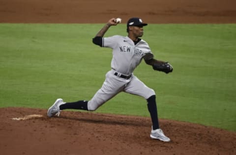 HOUSTON, TEXAS – OCTOBER 19: Miguel Castro #30 of the New York Yankees pitches during the eighth inning against the Houston Astros in game one of the American League Championship Series at Minute Maid Park on October 19, 2022 in Houston, Texas. (Photo by Bob Levey/Getty Images)