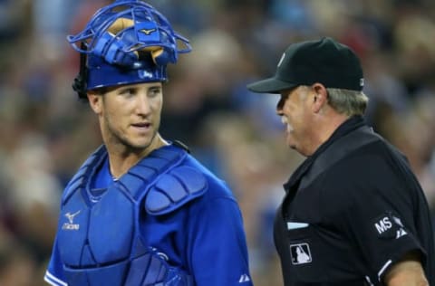 TORONTO, CANADA – AUGUST 11: Yan Gomes #68 of the Toronto Blue Jays talks to home plate umpire Jim Joyce #68 during MLB game action against the New York Yankees on August 11, 2012 at Rogers Centre in Toronto, Ontario, Canada. (Photo by Tom Szczerbowski/Getty Images)