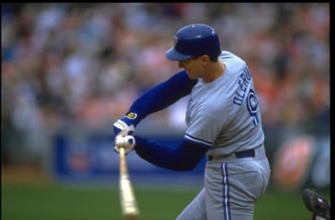 30 May 1993: JOHN OLERUD, FIRST BASEMAN FOR THE TORONTO BLUE JAYS, SWINGS AT A PITCH DURING THEIR GAME AGAINST THE OAKLAND A”S AT THE OAKLAND COLISEUM IN OAKLAND, CALIFORNIA.