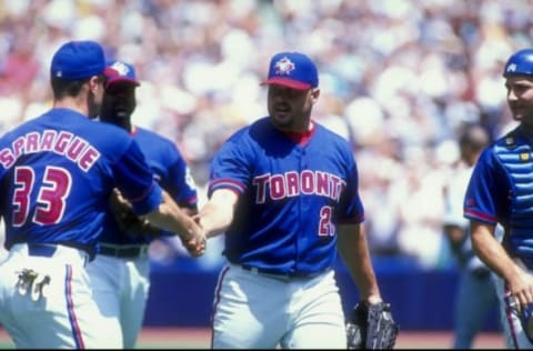 5 Jul 1998: Pitcher Roger Clemens #21 of the Toronto Blue Jays celebrates with teammates during a game against the Tampa Bay Devil Rays at the Sky Dome in Toronto, Canada. The Blue Jays defeated the Devil Rays 2-1. Mandatory Credit: Rick Stewart /Allsp