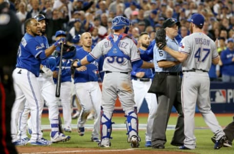 TORONTO, ON – OCTOBER 14: Benches clear in the seventh inning as Edwin Encarnacion #10 of the Toronto Blue Jays and Sam Dyson #47 of the Texas Rangers argue in game five of the American League Division Series at Rogers Centre on October 14, 2015 in Toronto, Canada. (Photo by Tom Szczerbowski/Getty Images)